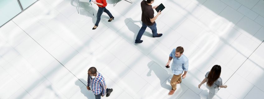 People walking on office concourse People walking on office concourse