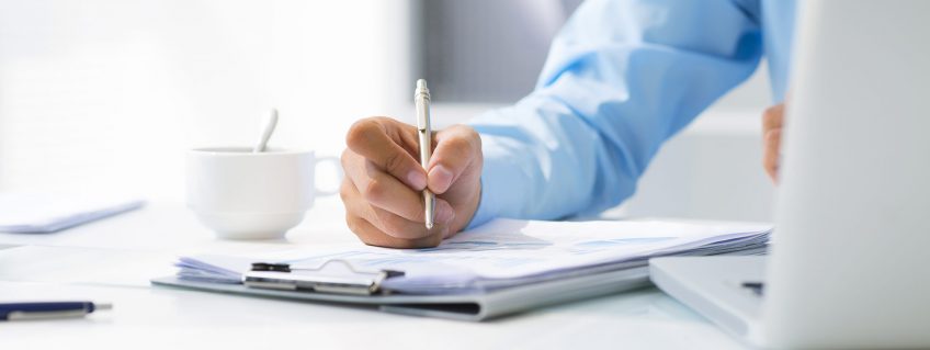 Close-up-of-male-hand-making-notes-in-office-1920x1281 Close-up-of-male-hand-making-notes-in-office-1920x1281